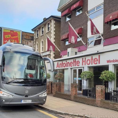 Airport transfer by coach to Antoinette Hotel, Wimbledon, London
